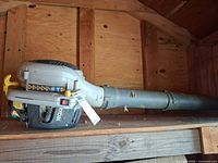 Full view of Ryobi gas blower on shelf