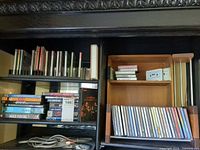 Shelf showing CDs, DVDs, cassette rack and CD rack