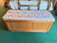 Full view of wooden chest with cushion on top