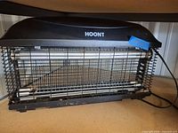 Front view of Hoont electric fly zapper showing overall form and brand label