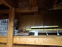 Front view of hot plates and trays on shelf, auction tag visible