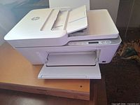 Front and top view of HP SNPRC-1901-01 printer with trays extended