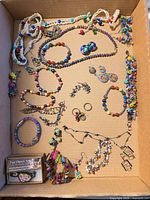 Overview of assorted bead jewelry in box