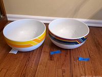 Both Mikasa mixing bowls showing size and exterior band patterns