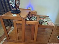 set of three wooden nesting tables stacked