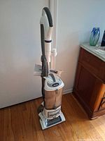 Full view of Shark Navigator vacuum standing upright
