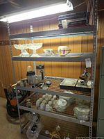 Full view of metal shelving unit with five wire shelves