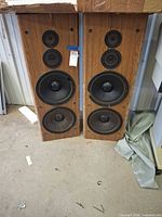 Front view of both KLH speakers showing driver arrangement and cabinet finish