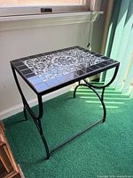 overall view of mosaic tile side table showing tile pattern and metal frame