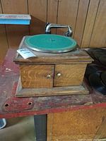 Front view of Victor VV-VI-A tabletop Victrola showing cabinet, turntable and tonearm