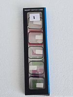 Front of retail package showing five smartwatch cases