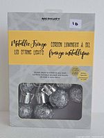 Factory box front showing product details and Merkury branding