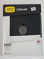 Front of boxed OtterBox Defender case