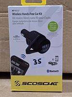 Front of Scosche BTFreq Wireless Hands-Free Car Kit box showing product image and features