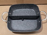Top view of square speckled sauteuse pan showing removable divider and dual handles