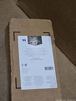 Boxed Amazon Basics foam roller showing front label with model details