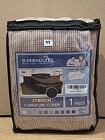 Front of sealed package showing H.Versailtex branding and ribbed beige slipcover inside