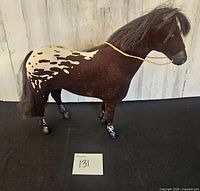 Left side view of plush Appaloosa horse
