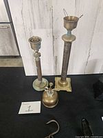 Overview of two candlesticks, plant mister, hook