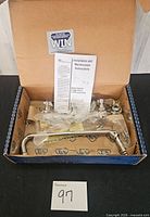 Full box view showing faucet, hardware, manual and box interior