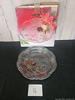 Platter displayed in front of its original box