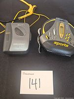 Sony WM-EX122 cassette Walkman and Sony Sports CD Walkman side by side