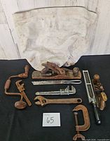 Front view showing entire lot: canvas bag and all tools laid out