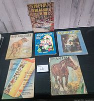 All six books laid out together front covers visible