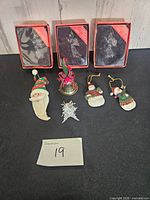 All ornaments displayed including three boxed angels, snowmen, Santa head, bell, snowflake
