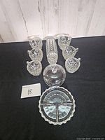 all items arranged: six cups, dome lid, small dish, relish tray, rectangular tray