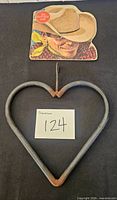 Book and heart iron chime overview with lot number