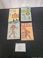 Front covers of four Boy Scouts of America handbooks