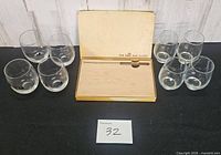 overview of bar slicer box open with board and six tumblers