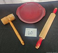 Top view of pie plate, rolling pin, wooden mallet