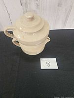 Full view of stacked stoneware double teapot with lid
