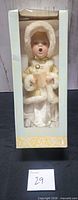 Front view of boxed singing Christmas caroling doll