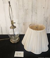 Full view of lamp with shade beside it