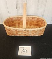 front view of the rectangular wooden handled basket