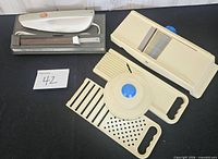 Full lot showing electric knife in base and mandoline slicer components