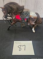 Left side view of Breyer horse with tack and hair