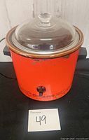 Full view of orange Rival Crock-Pot with glass lid