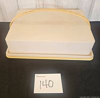 Carrier assembled showing lid, handle and base