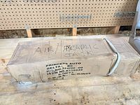 Cardboard carton labeled Air/Hydraulic Jack