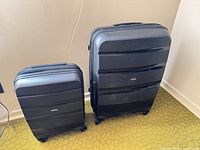 Front view of both suitcases upright