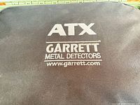 Padded cover with ATX Garrett logo