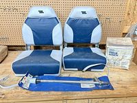Overall lot with two boat seats, boxed winch, packaged navigation light