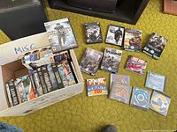 Overview of games on floor and box contents