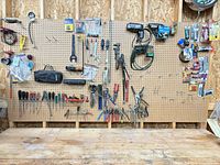 Wide view of entire pegboard showing all tools