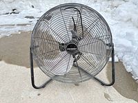 Front view of Mastercraft floor fan showing blades and grille