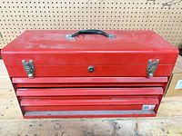 Closed red Mastercraft toolbox showing overall condition